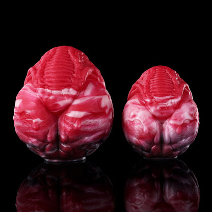Plug anal et vaginal œuf monstrueux infernal en silicone avec chaîne-laisse robuste (tailles M/L)