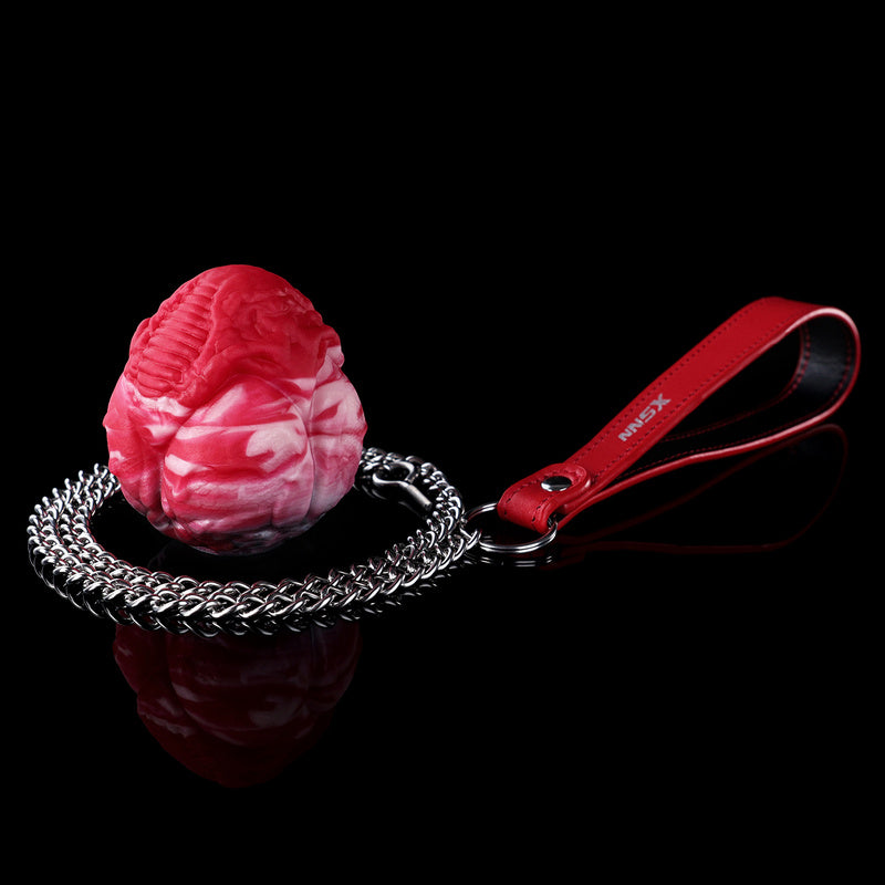 Plug anal et vaginal œuf monstrueux infernal en silicone avec chaîne-laisse robuste (tailles M/L)