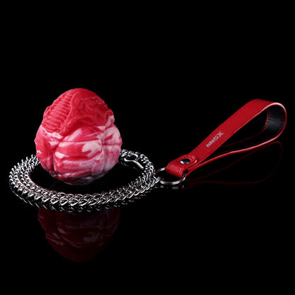 Plug anal et vaginal œuf monstrueux infernal en silicone avec chaîne-laisse robuste (tailles M/L)